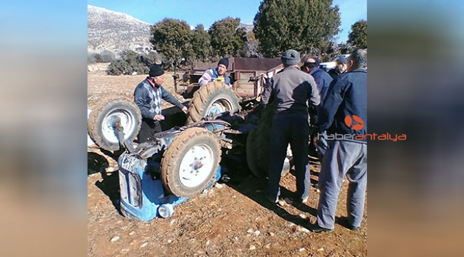 Devrilen traktörün altından kurtarıldı