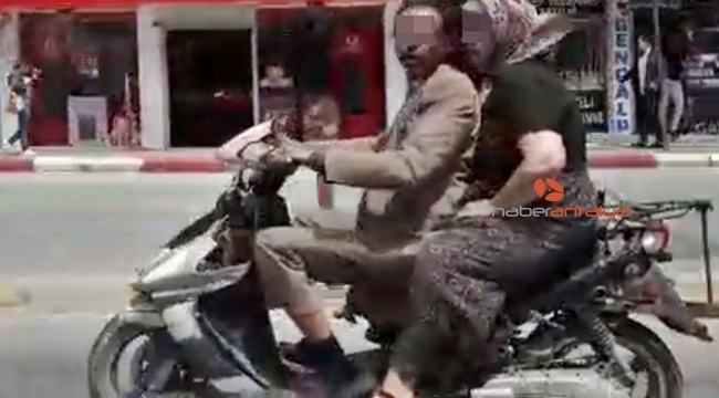 İşlek caddede hurda motosikletle tehlikeli yolculuk