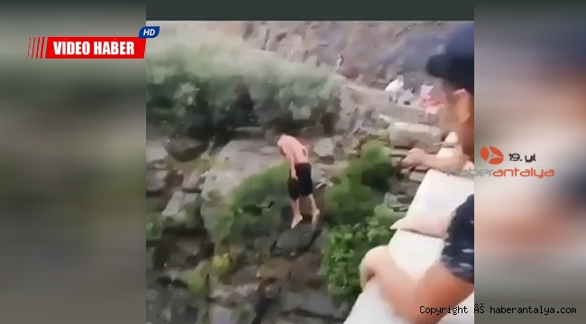 Metrelerce yükseklikten suya atlayan genç, yürekleri ağza getirdi !
