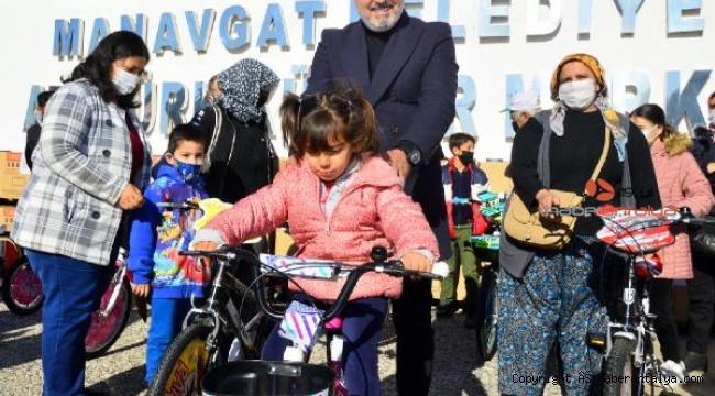 Manavgat Belediyesi'nden soba ve bisiklet desteği