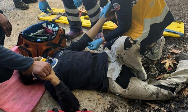 Tamir ettiği iş makinesinin altında kaldı