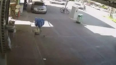 Aniden yola fırlayan bisikletli karşısında sürücünün son anda ki tepkisi kameraya yansıdı
