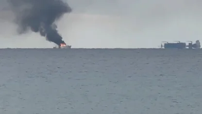 Kalkan açıklarında alev alan lüks teknedeki kaptan Sahil Güvenlik ekiplerince kurtarıldı