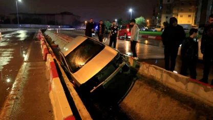 Kanala uçan otomobilin sürücüsü kazayı yara almadan atlattı